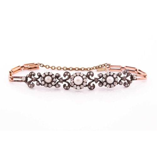 73 - A late 19th / early 20th century diamond bracelet, set with three clusters of old-cut diamonds centr... 