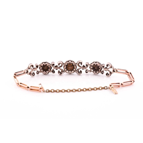 73 - A late 19th / early 20th century diamond bracelet, set with three clusters of old-cut diamonds centr... 