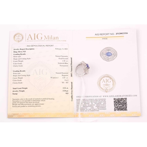 74 - A silver, diamond, and tanzanite ring, set east to west with a mixed oval-cut tanzanite of approxima... 