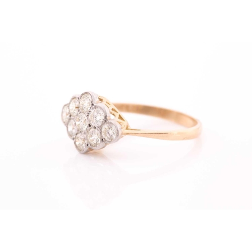76 - An 18ct yellow gold and diamond ring, set with a cluster of nine round brilliant-cut diamonds of app... 