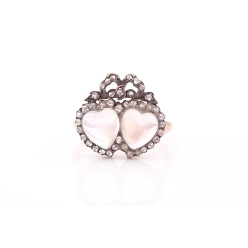 77 - An antique diamond and moonstone double heart ring, the mount set with heart-shaped cabochon moonsto... 