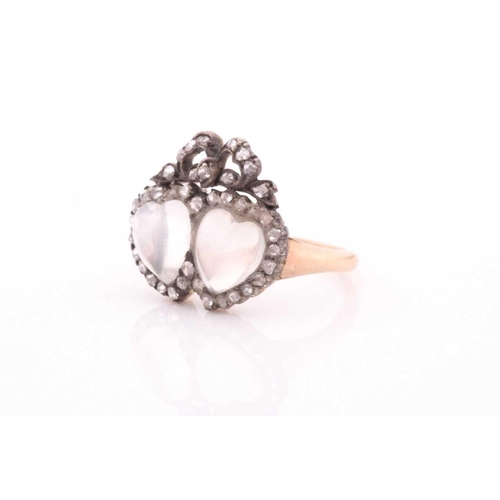 77 - An antique diamond and moonstone double heart ring, the mount set with heart-shaped cabochon moonsto... 