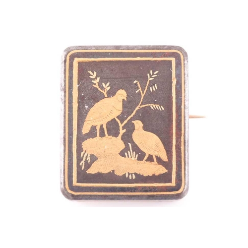 78 - A Victorian damascene brooch, in the Japanese style, depicting a gilt inlaid image of two birds in a... 