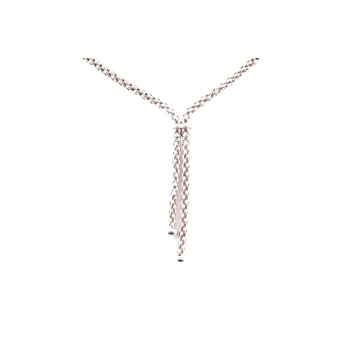 79 - Fope, Italy. An 18ct white gold chain necklace, the lavaliere style with two drops with rounded term... 