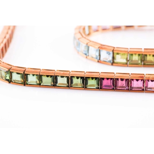 80 - An 18ct yellow gold and multi-gemstone rainbow necklace, bracelet, and matching earrings, the neckla... 