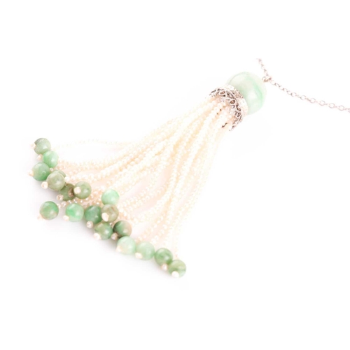 81 - An Art Deco jade and seed pearl tassel pendant necklace, set with a rounded jade bead suspended with... 