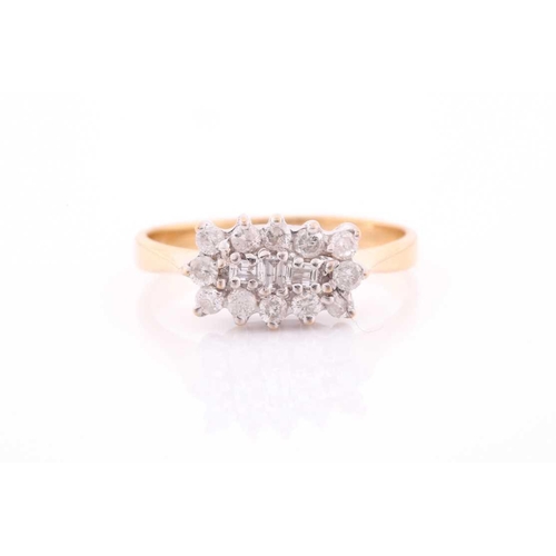 82 - An 18ct yellow gold and diamond cluster ring, centred with three emerald-cut diamonds surrounded wit... 