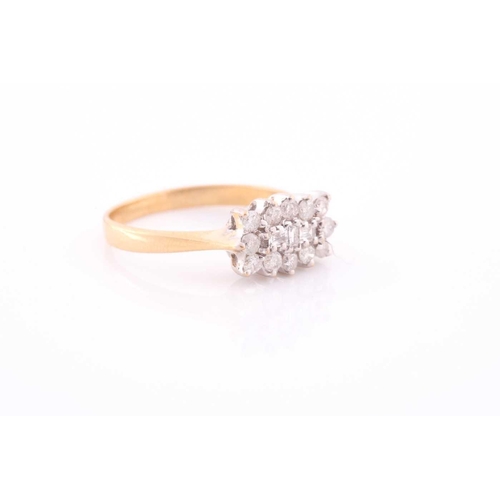82 - An 18ct yellow gold and diamond cluster ring, centred with three emerald-cut diamonds surrounded wit... 