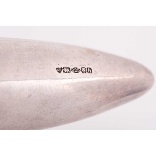 83 - A silver gilt torpedo-shaped pendant, unscrewing to reveal empty interior, rope-twist decoration to ... 