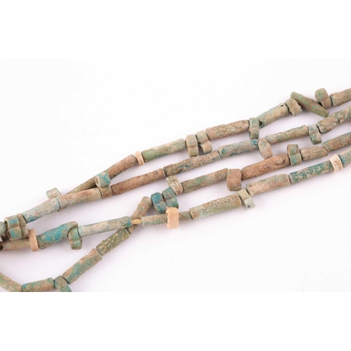 84 - An Egyptian style mummy bead necklace, possibly restrung, comprising vari-shape turquoise-coloured f... 