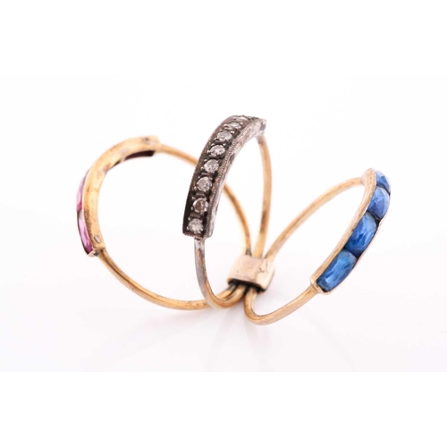 85 - A yellow metal, diamond, and paste stone triple band ring, fastened to underside, set with a central... 