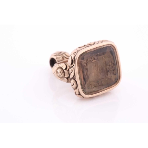 88 - A yellow metal and citrine quartz fob pendant, the intaglio engraving bearing a motto and coat-of-ar... 