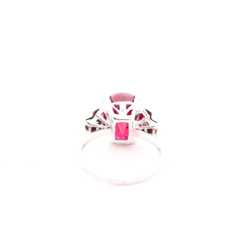 92 - A white metal, diamond, and white and red stone ring, in the Art Deco style, set with rose-cut white... 