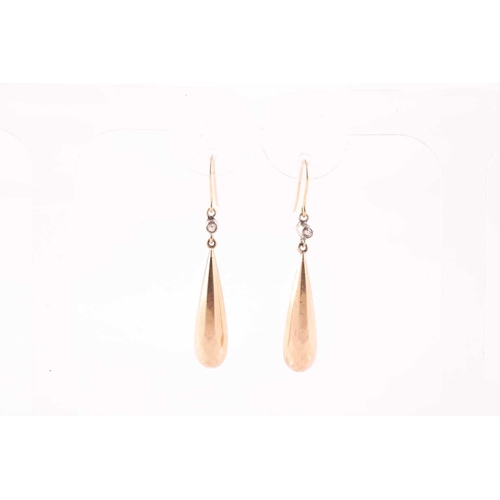 93 - A pair of yellow metal and diamond drop earrings, in the Victorian style, set with hollow tapered dr... 