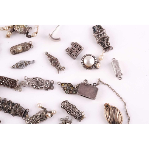 94 - A mixed group of various silver and marcasite set necklace clasps, of various designs and sizes.