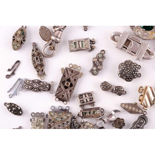 94 - A mixed group of various silver and marcasite set necklace clasps, of various designs and sizes.
