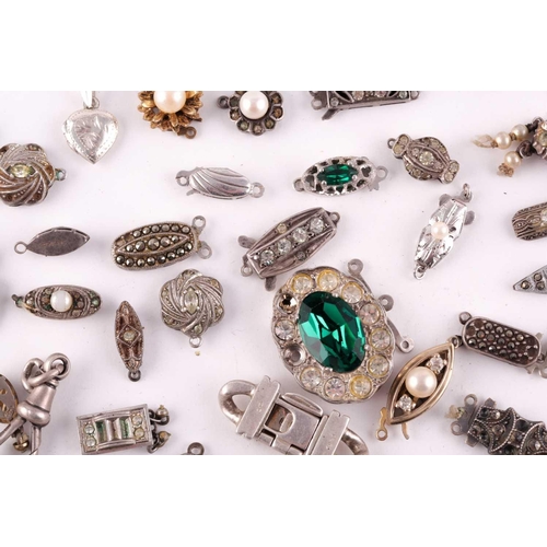 94 - A mixed group of various silver and marcasite set necklace clasps, of various designs and sizes.