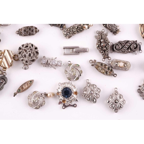 94 - A mixed group of various silver and marcasite set necklace clasps, of various designs and sizes.