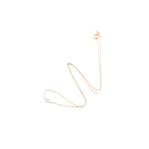 95 - An 18ct yellow gold and diamond necklace, the chain set with a collet-mounted round brilliant-cut di... 