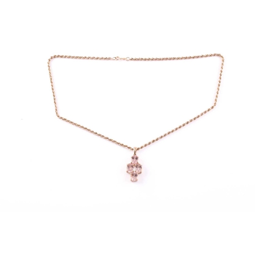 97 - A 9ct yellow gold and morganite pendant, set with four mixed oval-cut morganites with chequerboard f... 