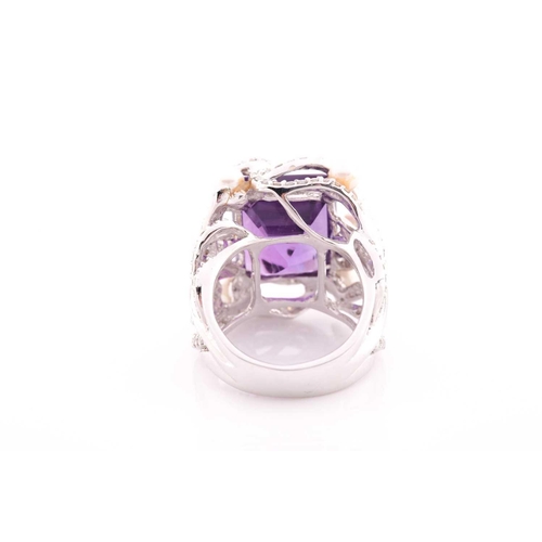 99 - An impressive diamond and amethyst cocktail ring, centred with a mixed square-cut amethyst, mounted ... 