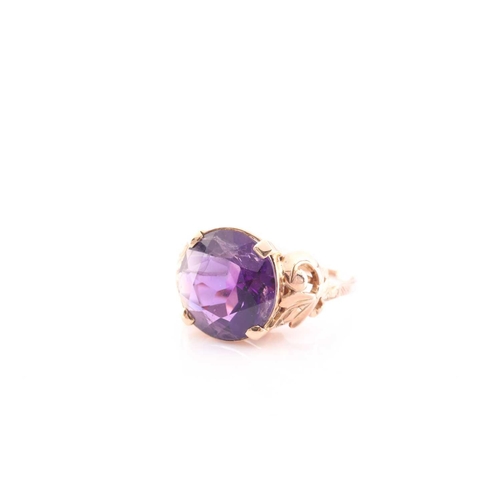 102 - A Continental yellow metal and round amethyst single stone ring, the round mixed-cut stone approxima... 