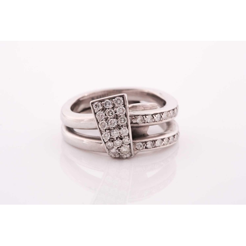 105 - An unusual white metal and diamond ring, of folded knot design, inset with round brilliant-cut diamo... 