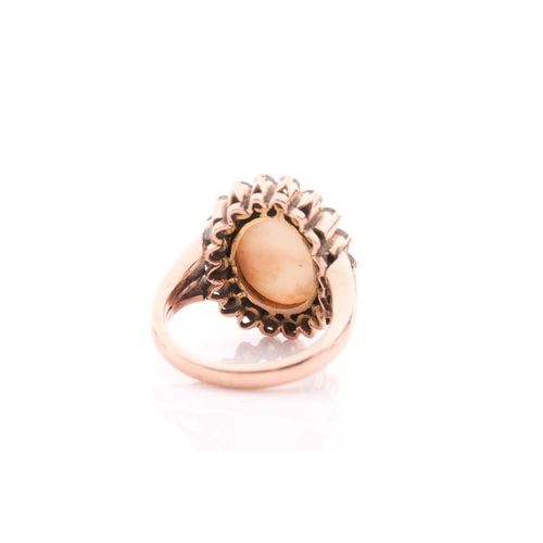 113 - A diamond and opal dress ring, set with an oval cabochon opal within a rubover setting, surrounded w... 