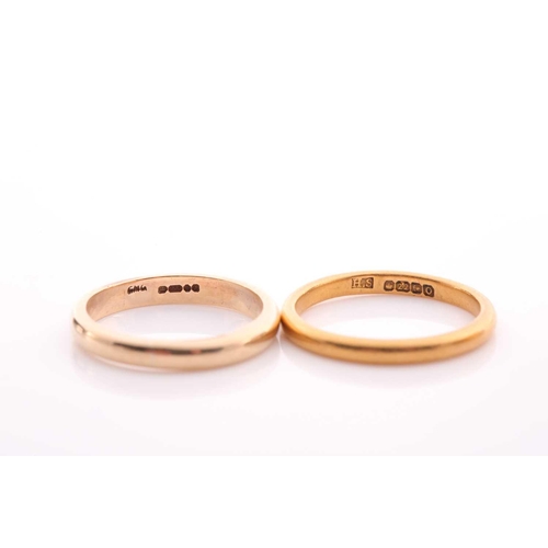 115 - A 22 carat gold wedding band, another 22 carat gold wedding band, 8.5 grams; a wide 9 carat gold wed... 