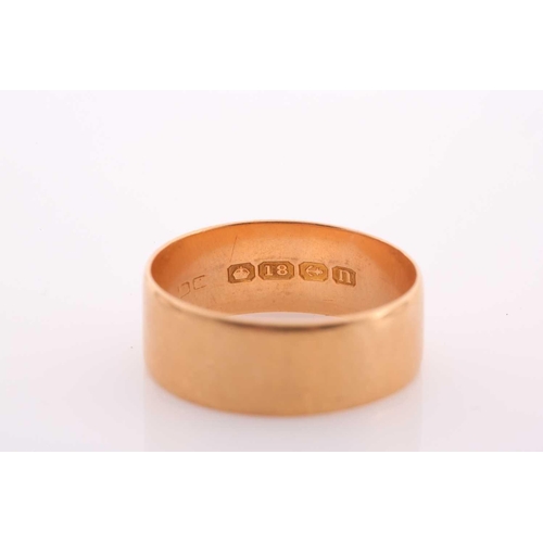124 - An early 20th century 18ct gold broad wedding band, Birmingham 1912, 8.3mm wide, leading-edge size Z... 