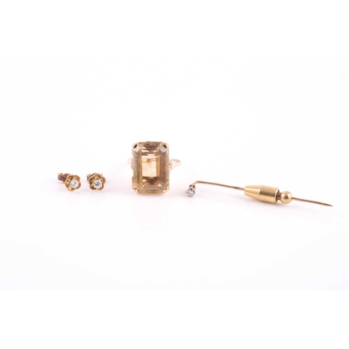 142 - A 1960’s 9ct gold and citrine ring, a diamond stick pin and a pair of diamond stud earrings; the rin... 