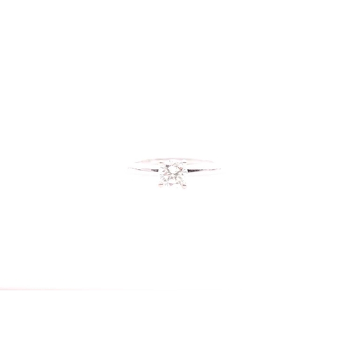 146 - An 18ct white gold and solitaire diamond ring, set with a round brilliant-cut diamond, approximate c... 