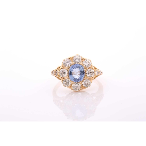 152 - A modern sapphire and diamond oval cluster ring in Victorian style, centred with an oval native-cut ... 