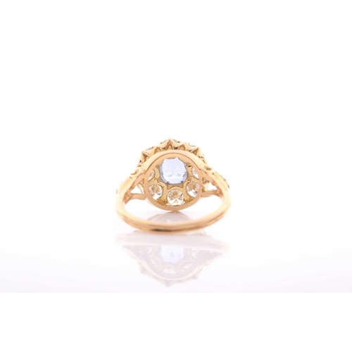 152 - A modern sapphire and diamond oval cluster ring in Victorian style, centred with an oval native-cut ... 