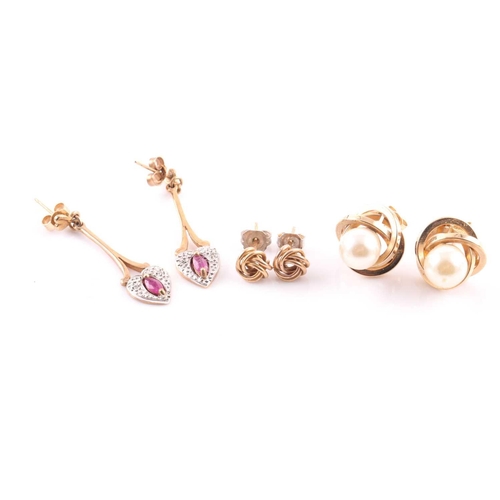 168 - A pair of ruby and diamond pendant earrings in 9 carat gold mounts; a pair of knot earrings and a pa... 