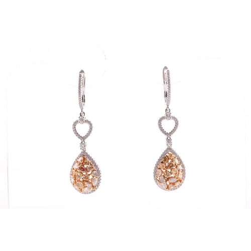 184 - A pair of modern diamond drop-shaped cluster pendant earrings, each with a treated yellow diamond bo... 