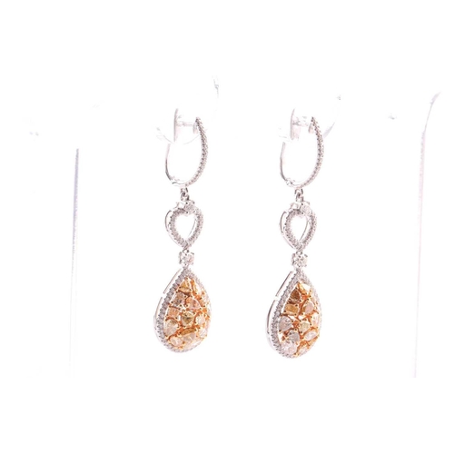 184 - A pair of modern diamond drop-shaped cluster pendant earrings, each with a treated yellow diamond bo... 