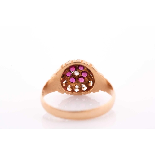 209 - An 18ct yellow gold, diamond, and ruby floral cluster ring, the claw-raised mount pave-set with mixe... 