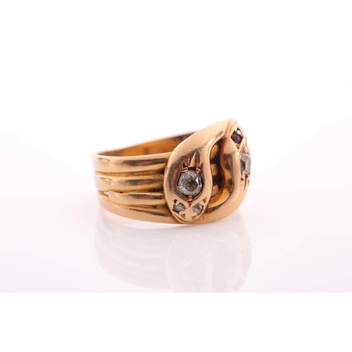216 - A Victorian ruby and diamond double serpent ring; one of the crossover heads set with an old-cut dia... 