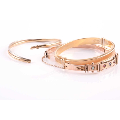 69 - Three 9ct gold bangles, comprising; an Edwardian rose gold and gem set hollow rectangular-section hi... 