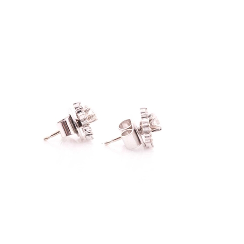 70 - A pair of diamond cluster earrings, set with a round-cut diamond of approximately 0.16 carats, withi... 