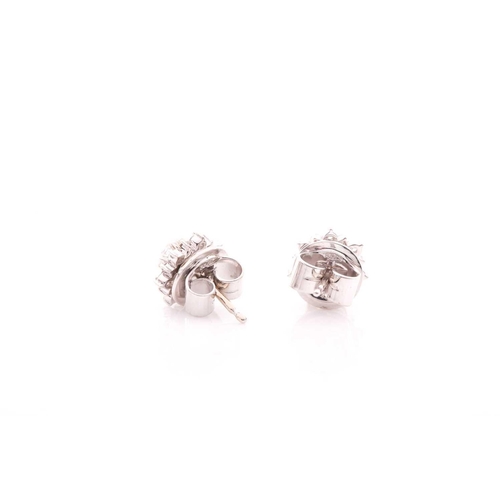 70 - A pair of diamond cluster earrings, set with a round-cut diamond of approximately 0.16 carats, withi... 