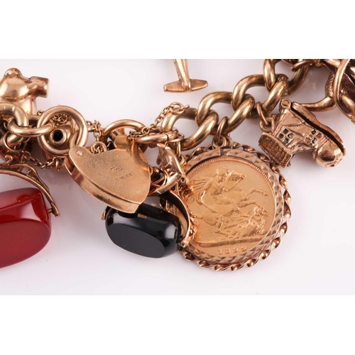 81 - A 9ct gold curb link ‘charm bracelet on a padlock clasp, London 1975, and hung with 16 various charm... 