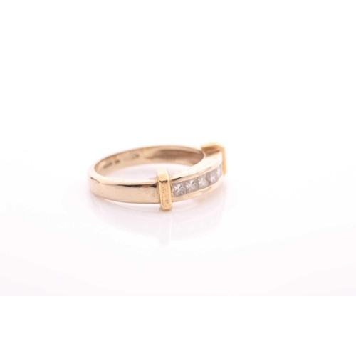 82 - A seven stone half hoop diamond ring; the princess cut diamonds channel set within a bi coloured 18 ... 