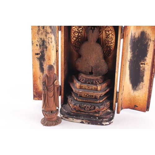 106 - A Japanese lacquered travelling shrine, Zushi, 19th century, the gilt interior with a carved softwoo... 