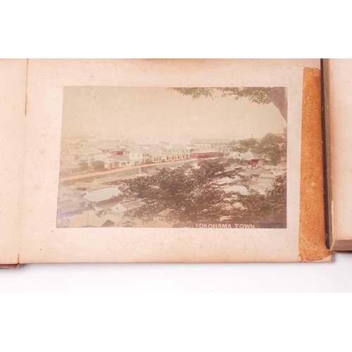 117 - A Japanese shibayama concertina photograph album, late Meiji, containing fifty hand coloured photogr... 