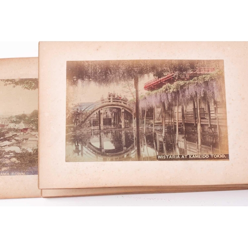 117 - A Japanese shibayama concertina photograph album, late Meiji, containing fifty hand coloured photogr... 