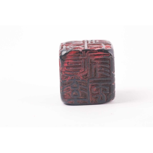 121 - A Chinese red soapstone five sided seal, of square form with an inscribed poem, 2.9cm