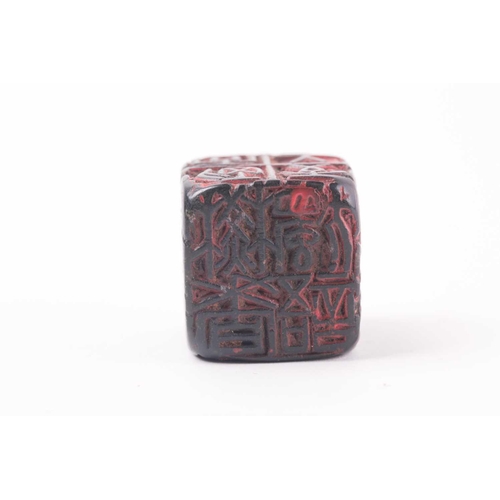 121 - A Chinese red soapstone five sided seal, of square form with an inscribed poem, 2.9cm