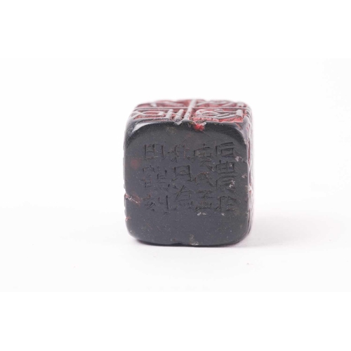 121 - A Chinese red soapstone five sided seal, of square form with an inscribed poem, 2.9cm